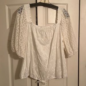 Large white with lace sleeves 3/4 length sleeves.